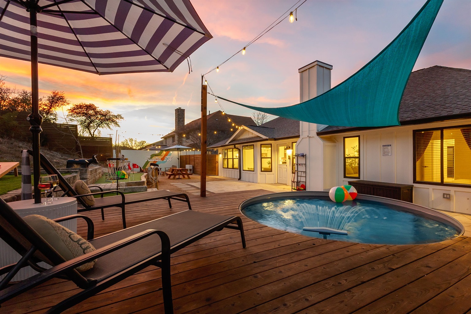 Golden hour hits different when you're on the deck with a cowboy pool, shade sails, and nowhere else to be.