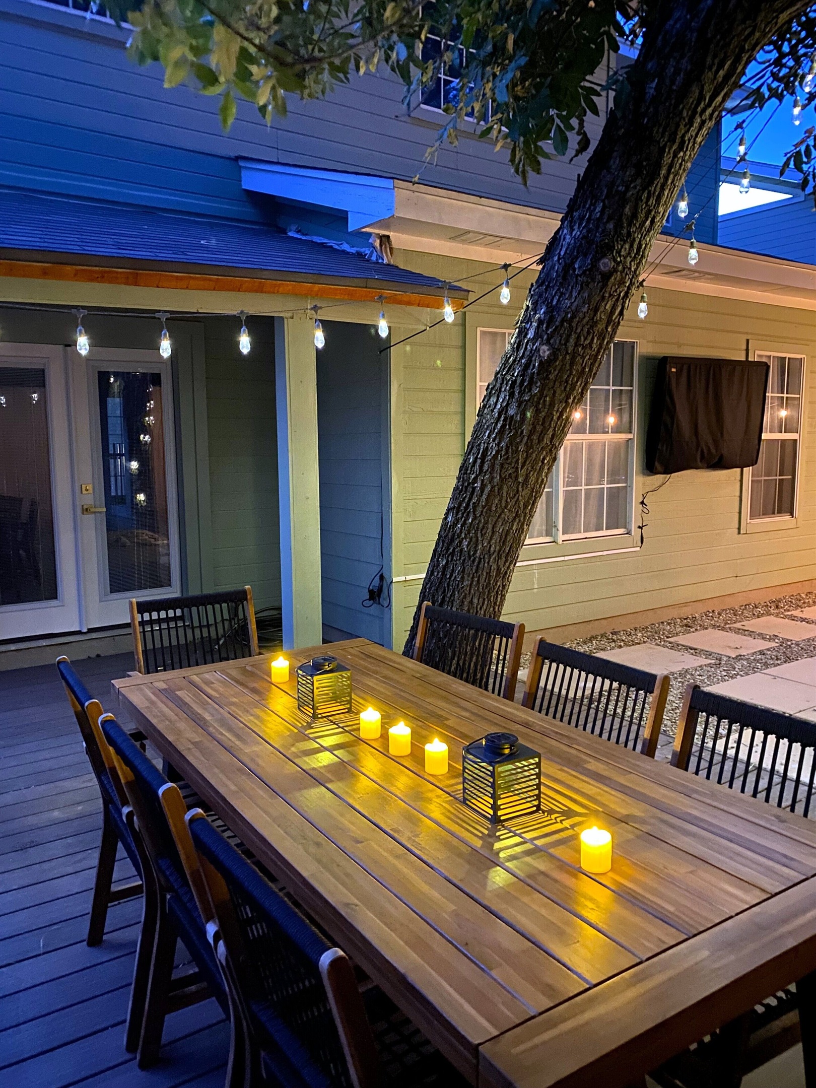 Dine outdoors beneath the gentle glow of string lights and candlelit lanterns. Our stylish patio setup creates a serene, inviting ambiance for memorable evenings. Enjoy a refined and relaxing experience in this beautiful open-air space.