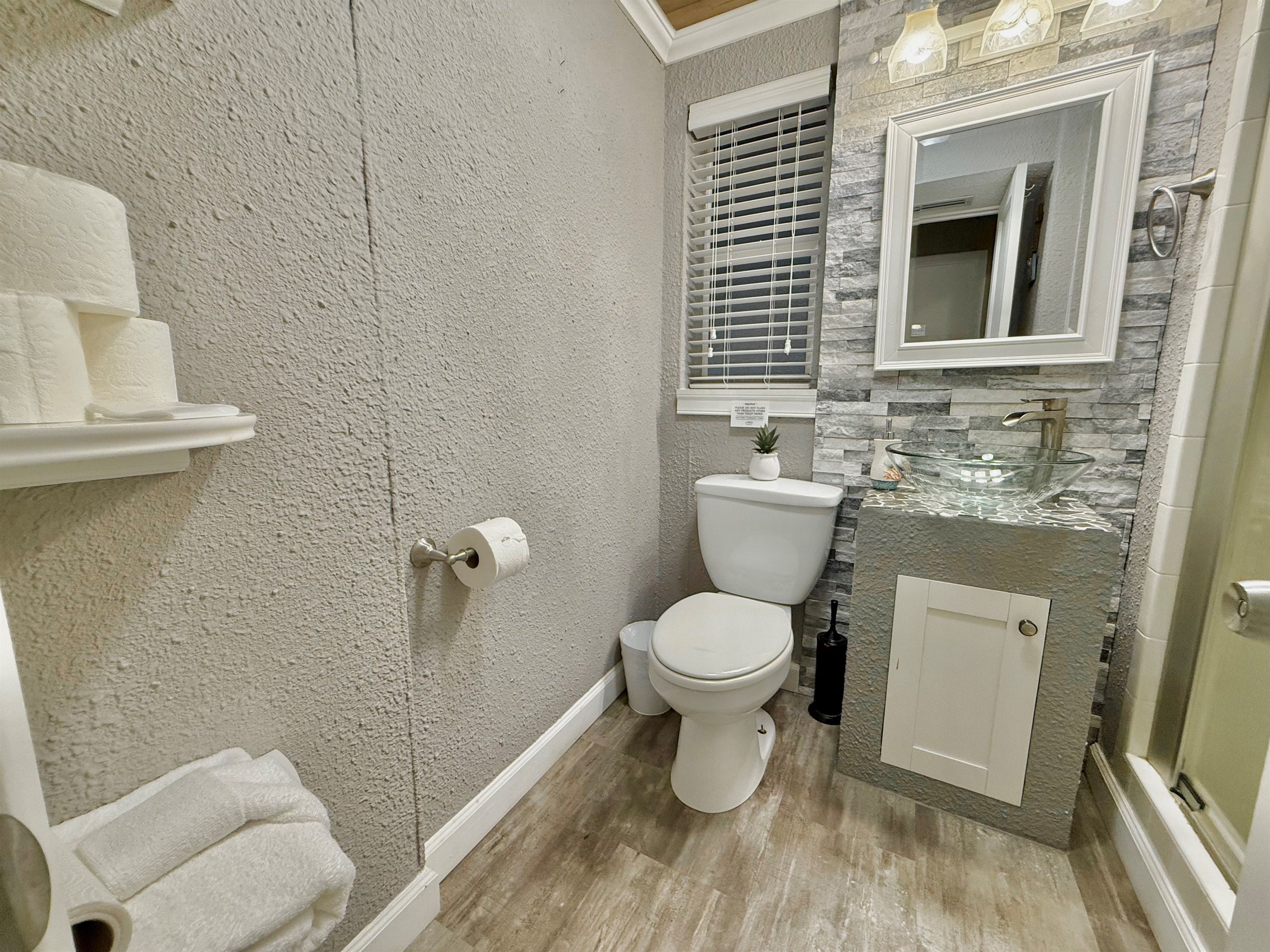 Equipped with modern lighting, beautiful tile work, and all the essentials—this space is practical and peaceful.