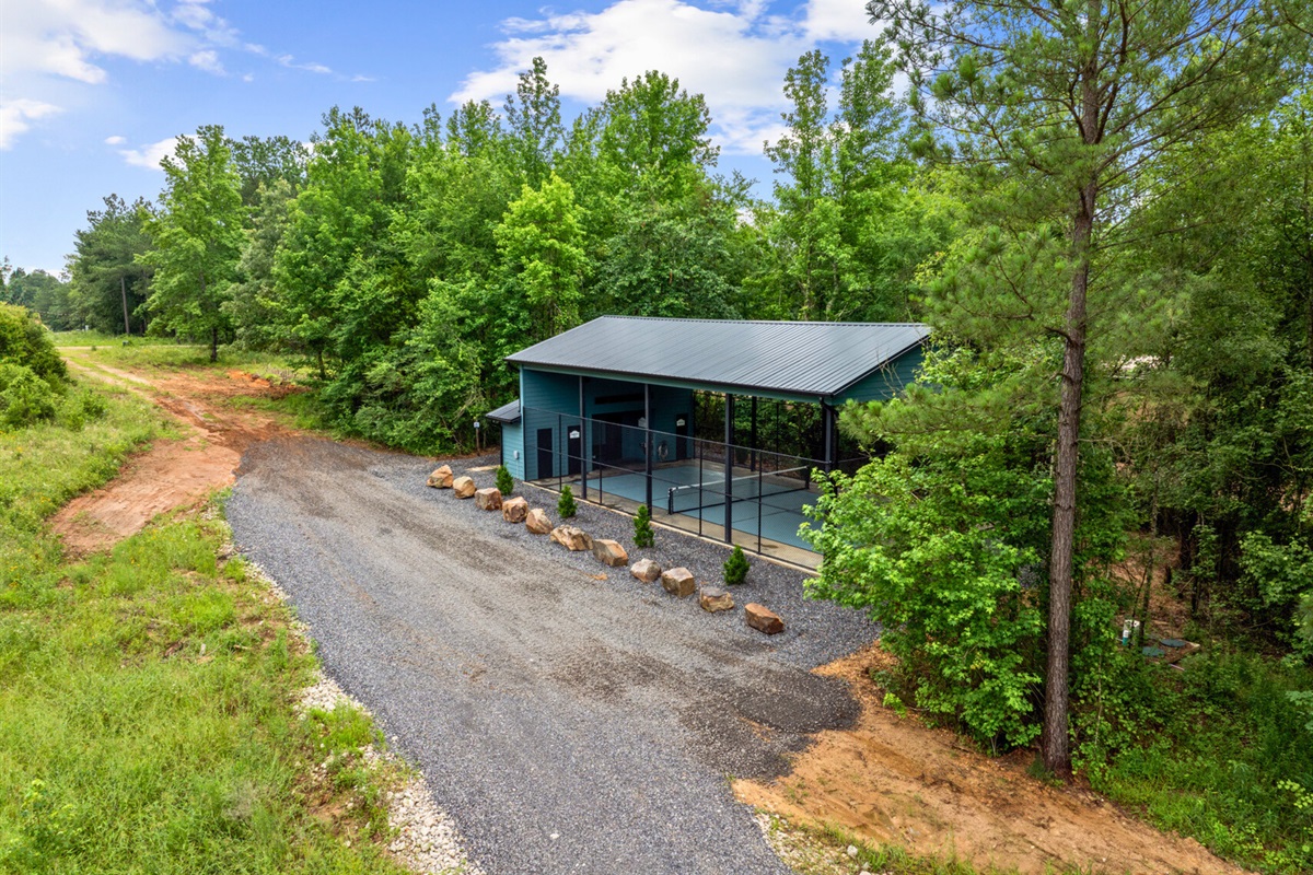 Enjoy a peaceful match in this beautifully designed court surrounded by lush greenery.