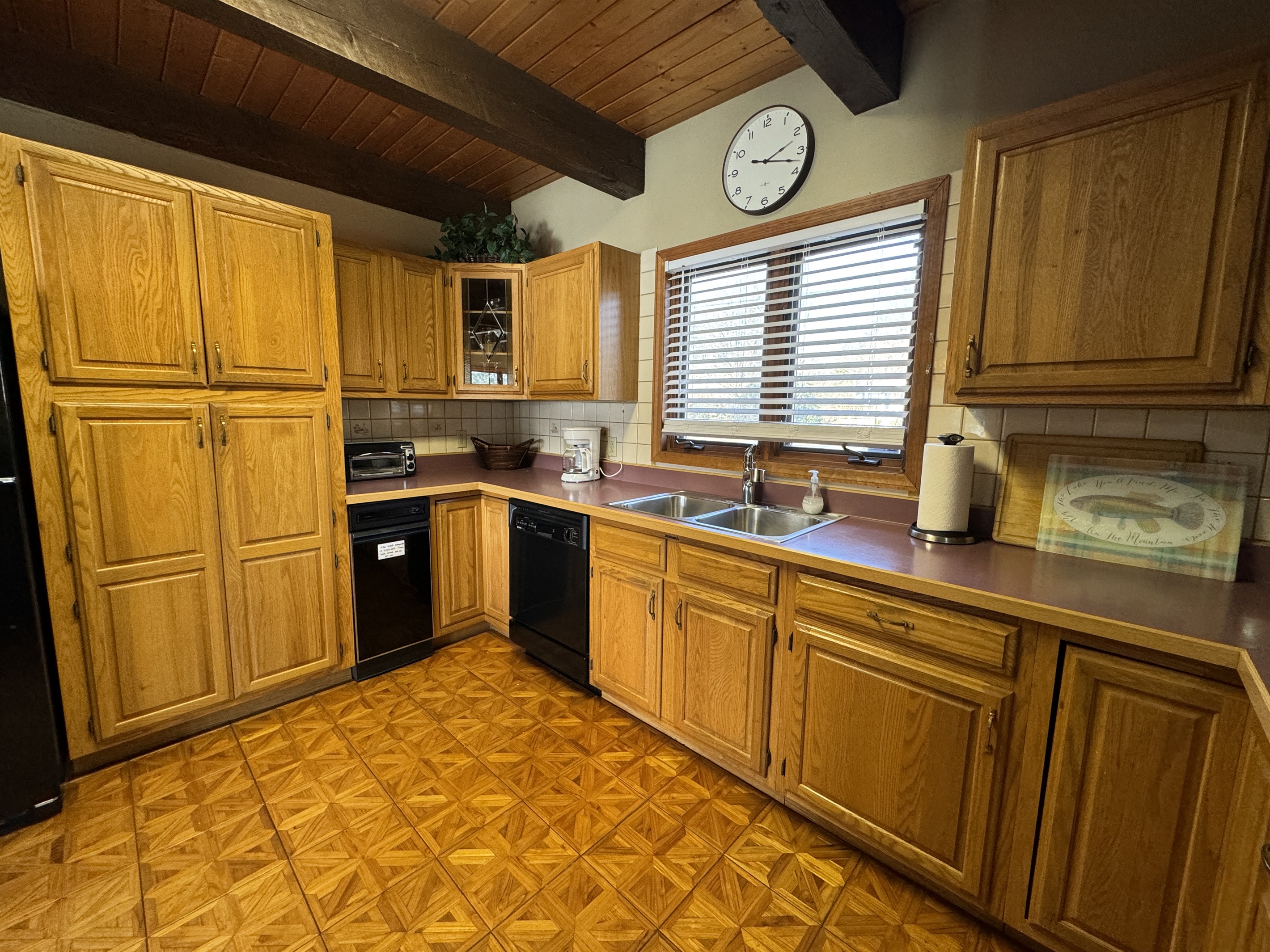 Camp Havon kitchen space with pantry and dishwasher .