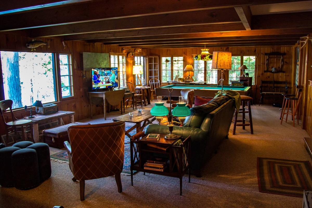 The living room looking out to the lake is a great place to gather and watch a movie on the smart tv.