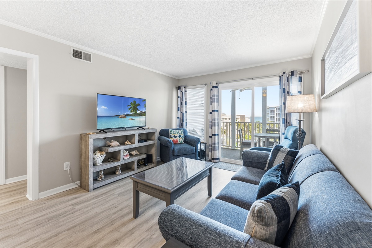 Spacious Living room with sleeper sofa and large TV