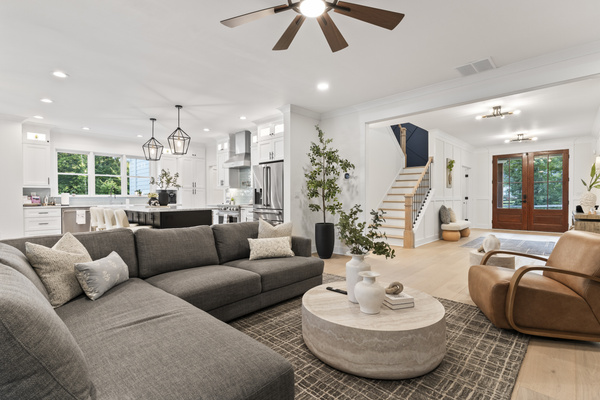 Comfortable sofa in living room with open floor plan.