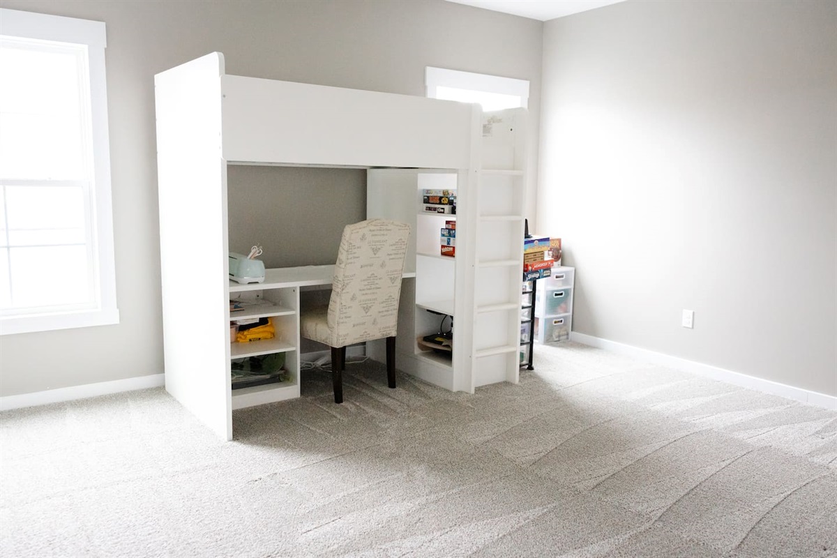 3rd floor open bonus area -- to the right of the top of the steps. A workspace and chair with the option of an additional twin bed here.