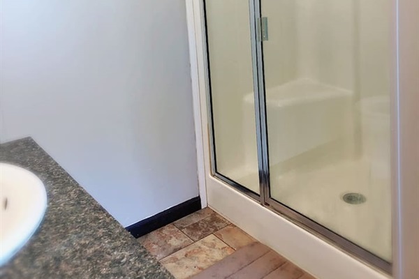 Large walk in shower in master bathroom. 