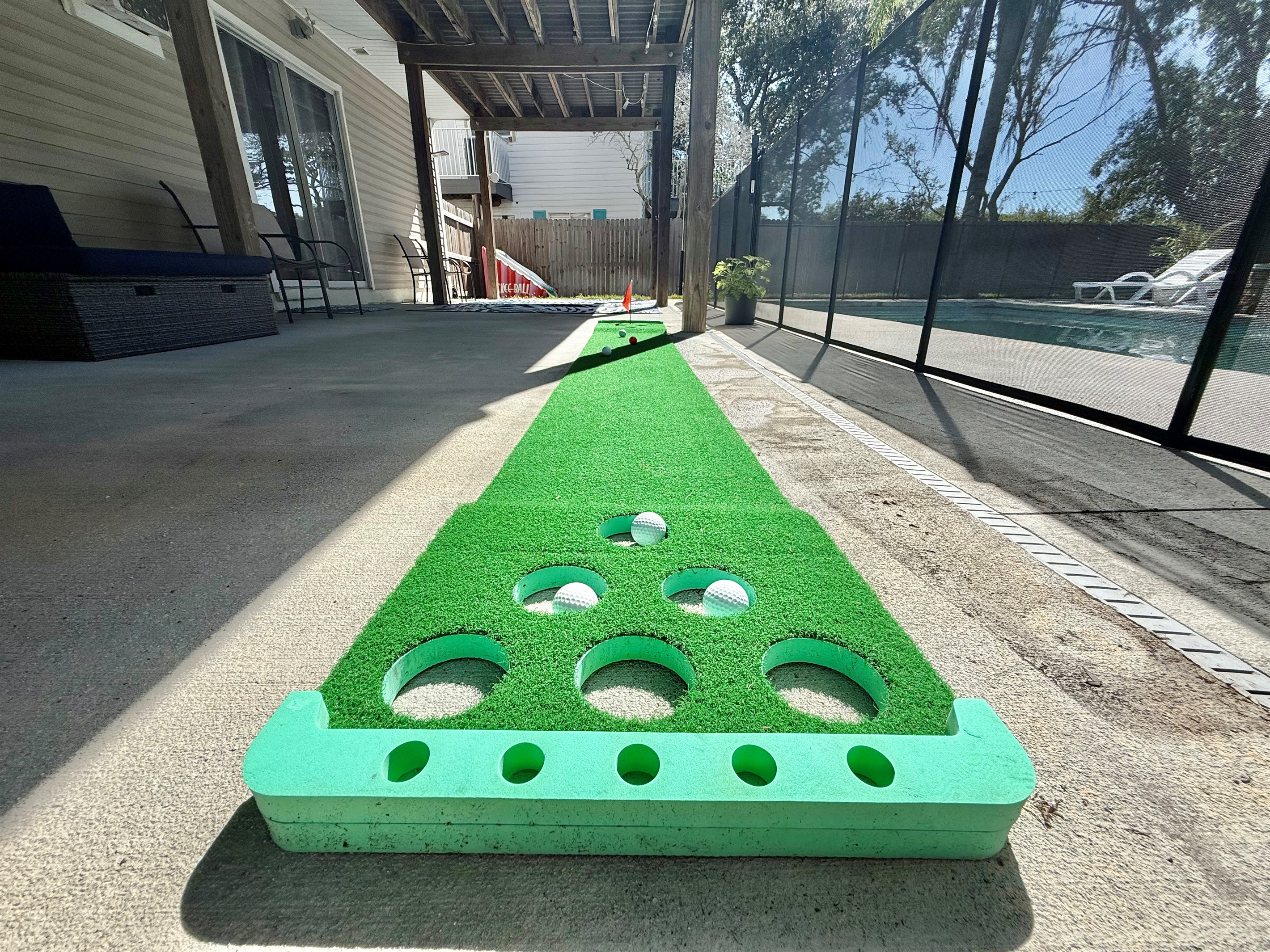 Challenge friends to mini-golf or cornhole steps away from the pool.
