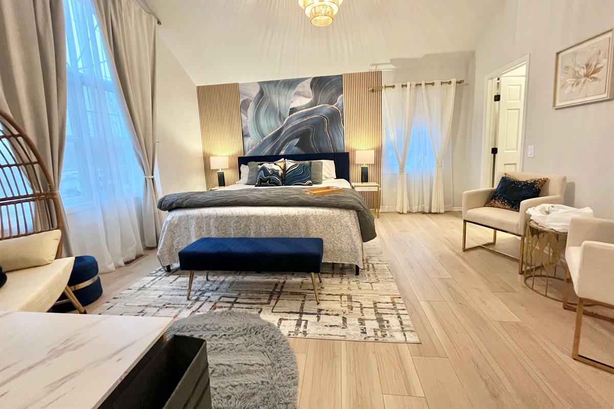 Beautiful master bedroom with king bed and  cathedral ceiling