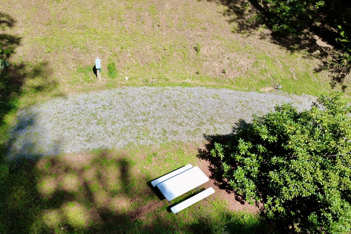 Your home base in the mountains — Site 3 is ready for RVs under 30 ft with full hookups & picnic seating.