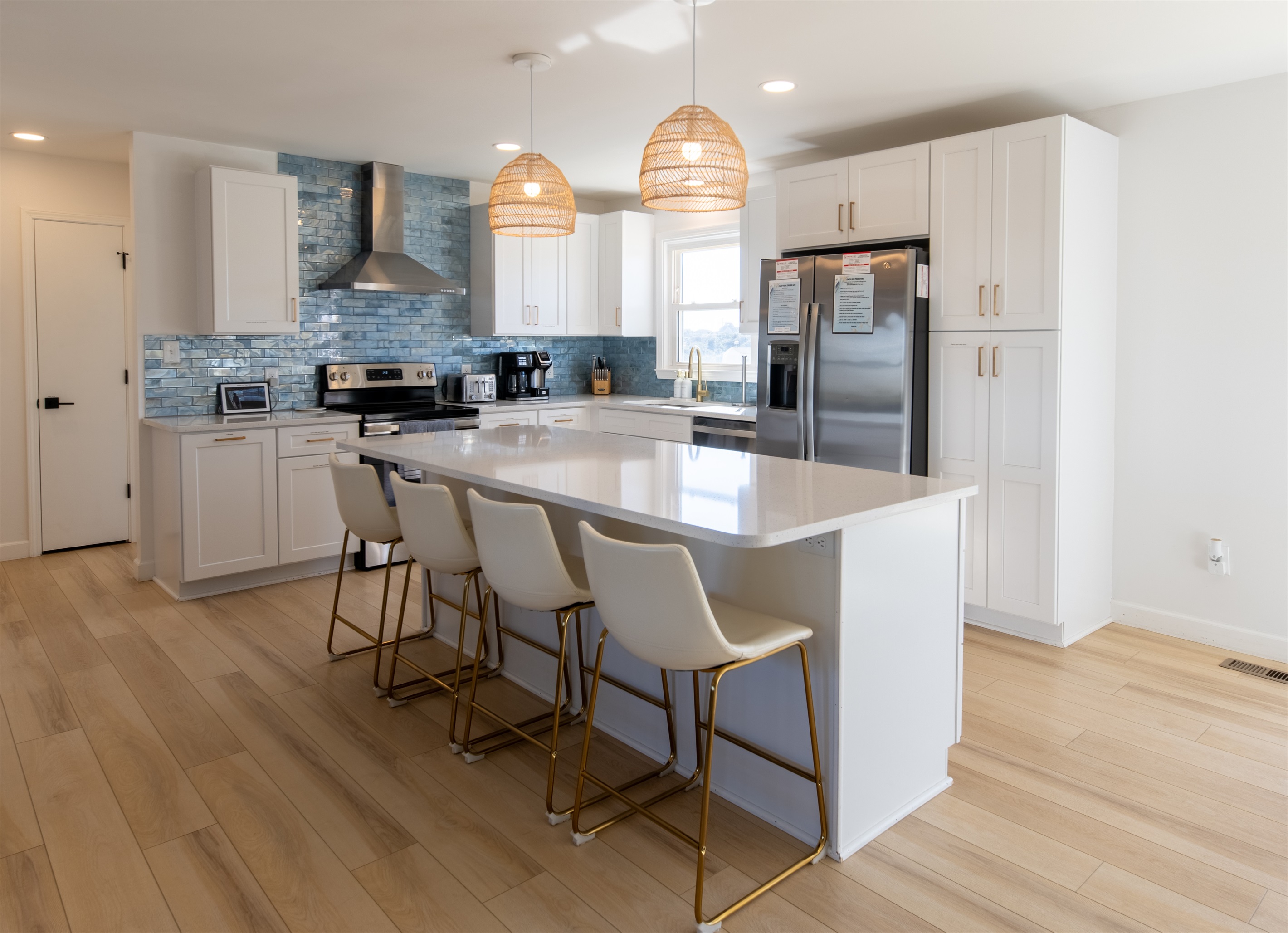 4-seat island separates the kitchen from the rest of the open floor plan room. The kitchen has plenty of space, storage, and all you'll need while at Treasure Chest. Cooking is a pleasure in this bright, beautiful, and well-stocked kitchen