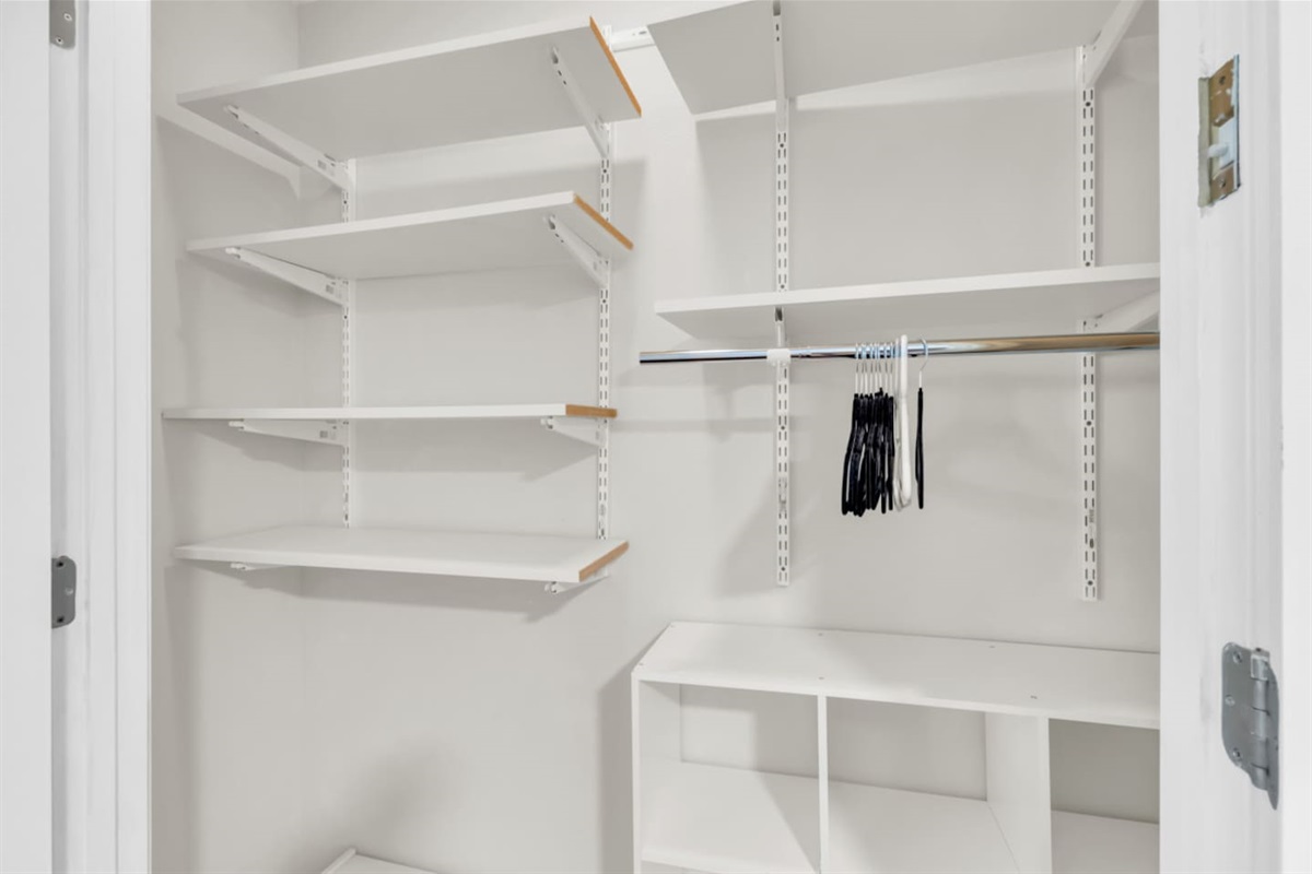 Spacious closet equipped with hangers and ample storage space, making it easy to unpack, stay organized, and settle in comfortably for both short and extended stays.