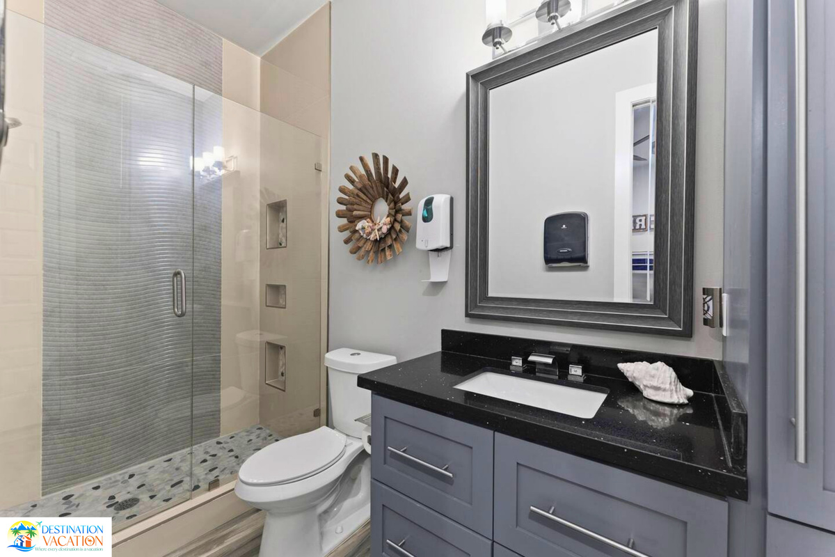 Modern fixtures elevate comfort throughout this beautifully designed bathroom.