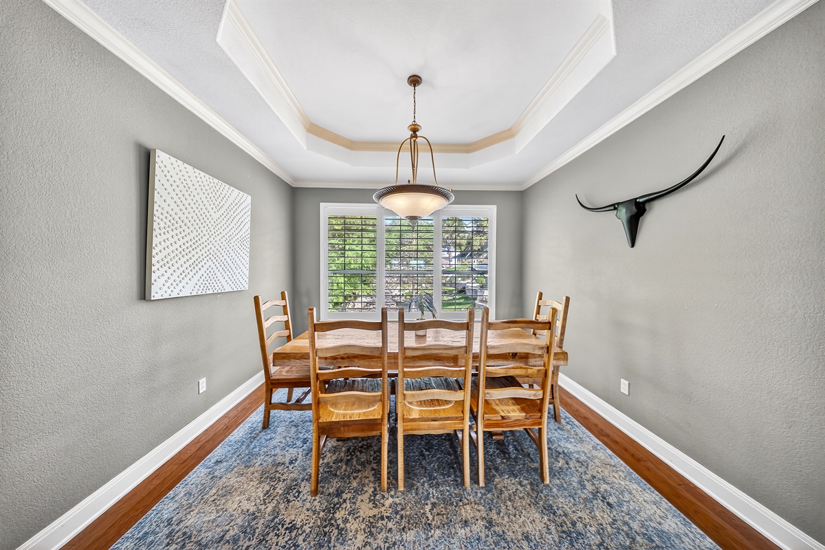 The dining room, conveniently located off the kitchen, provides an ideal setting for family meals. 