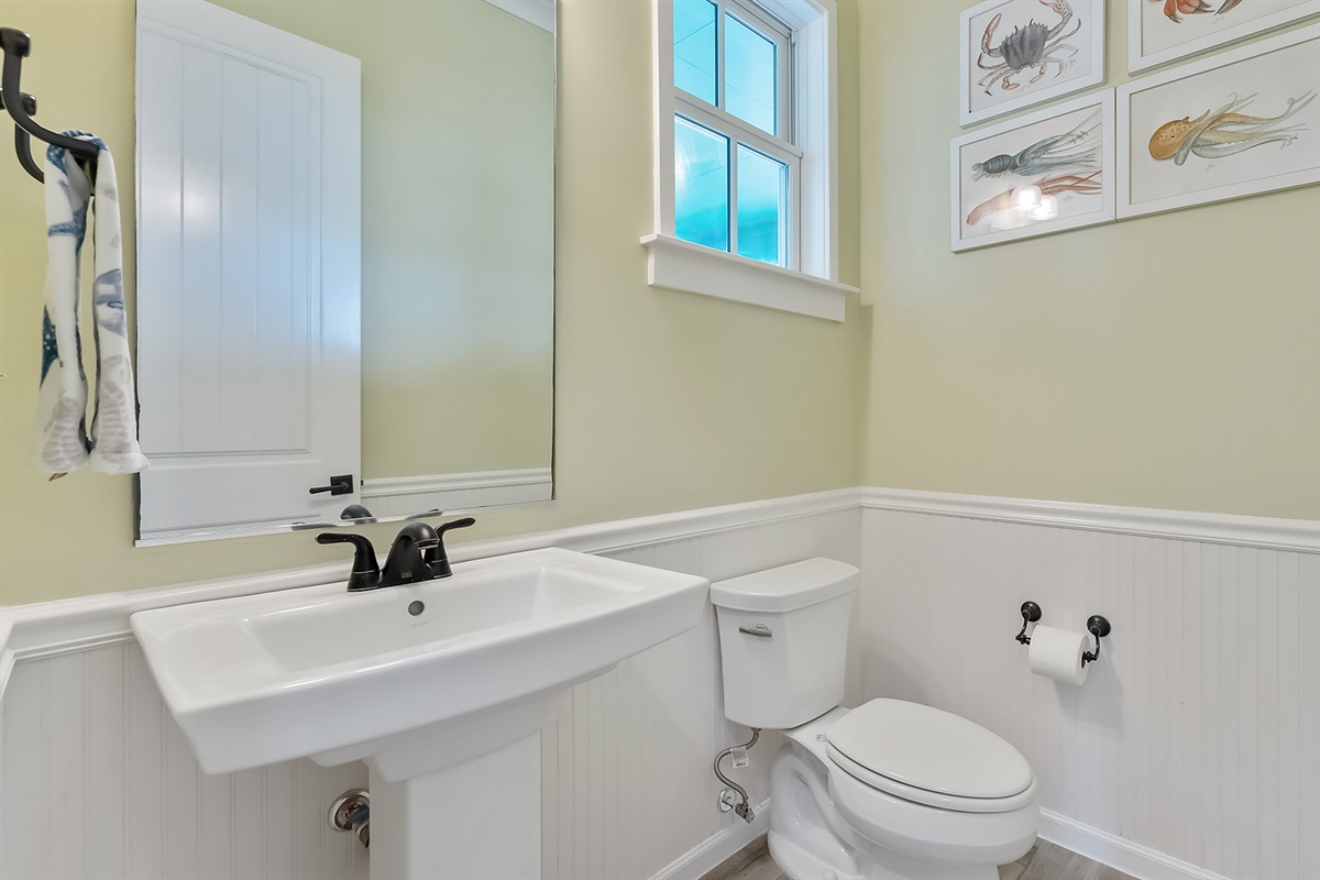 Half Bath #1: Just off the entry way on the first floor.