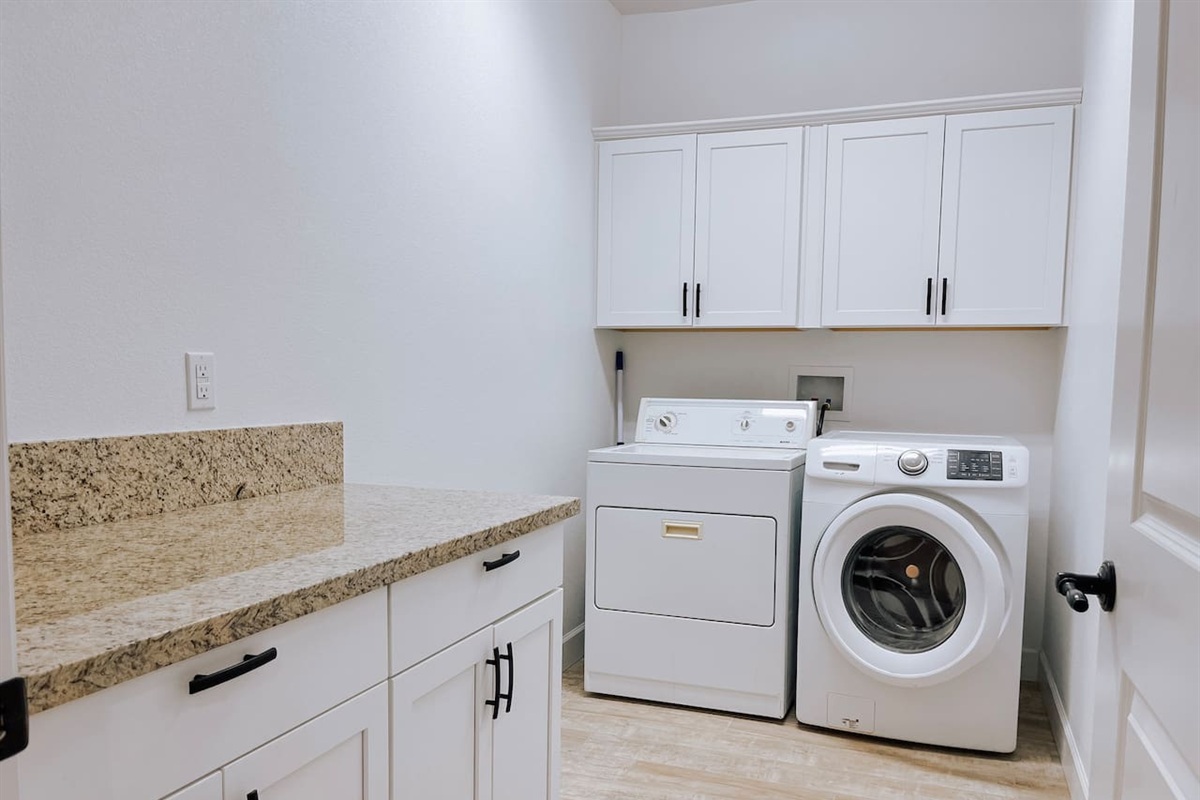 Dedicated laundry room with full size washer and dryer