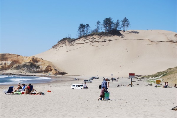 Cape Kiwanda with climbing, beautiful views, sand surfing, tide pools, and surfing.