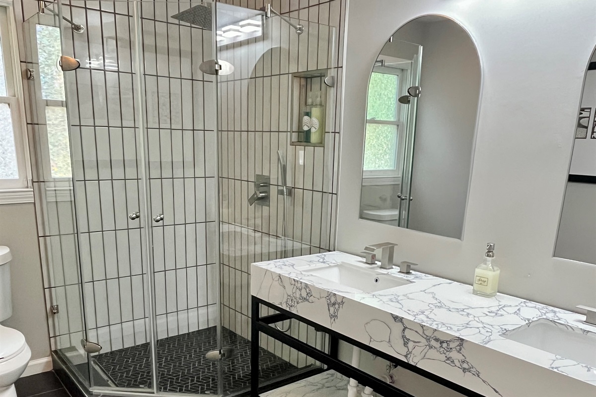 Bath 6: Large shower with double vanity on lower level