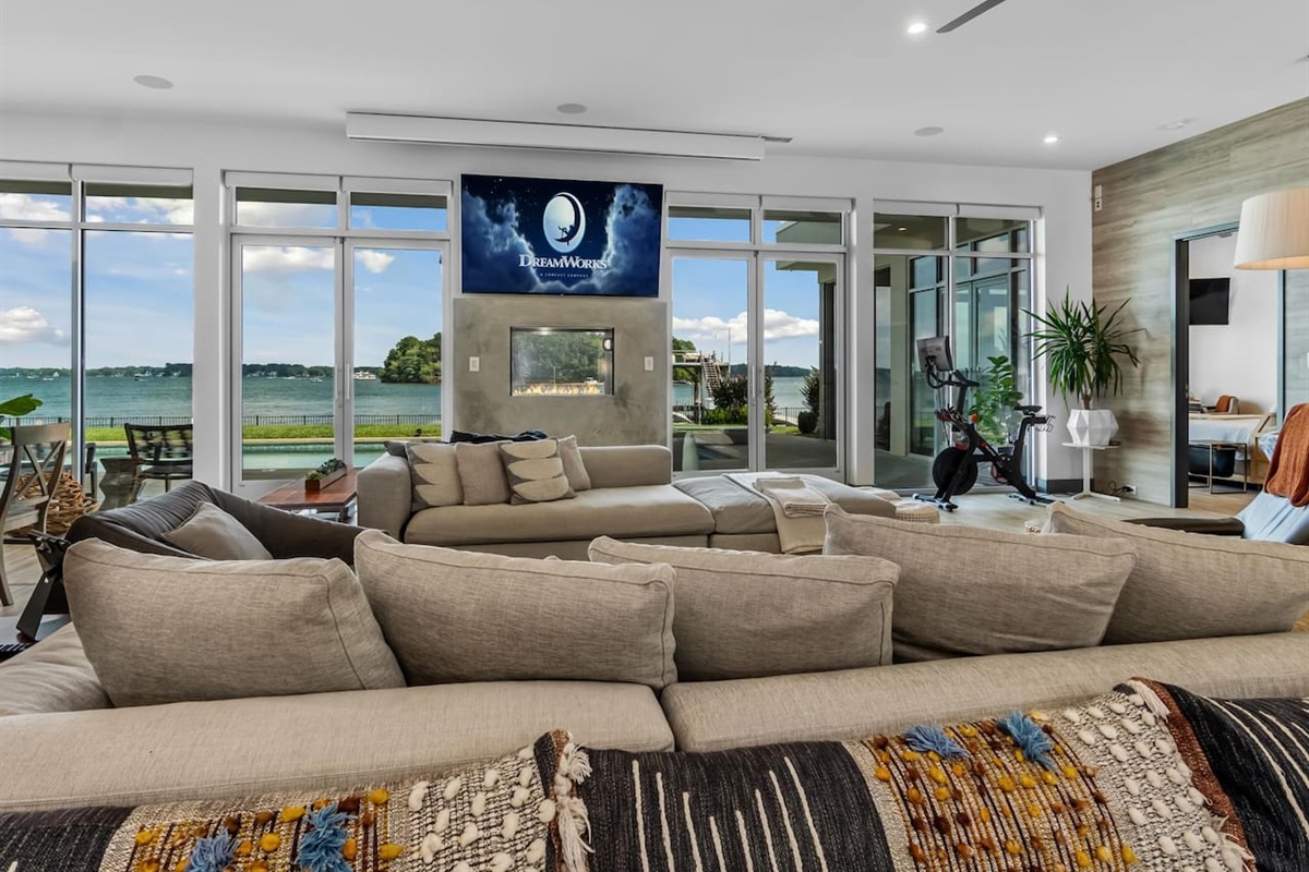 Living room with walls of glass overlooking long lake views on Lake Norman.