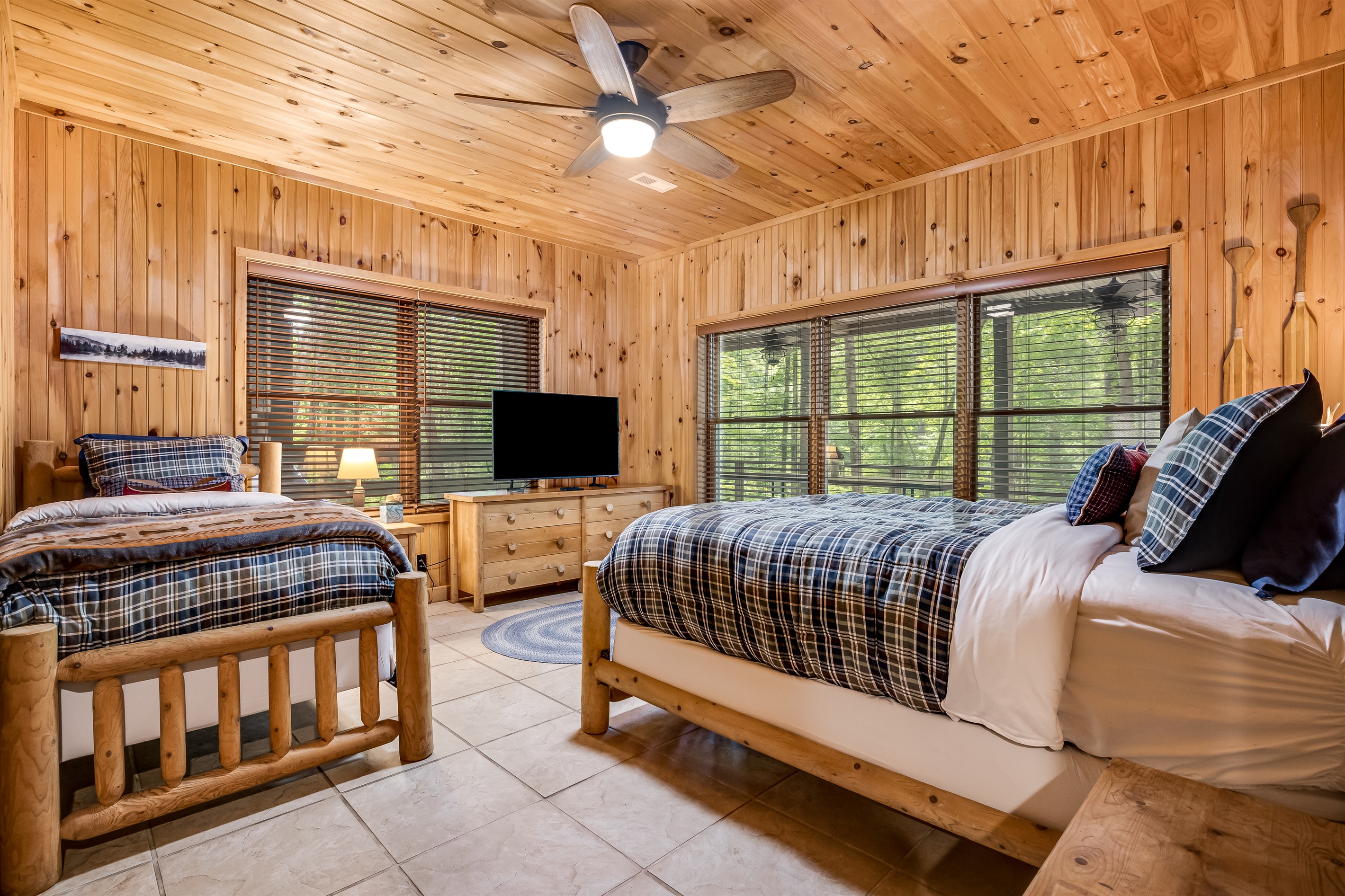 Lower level bedroom with queen bed and twin bed