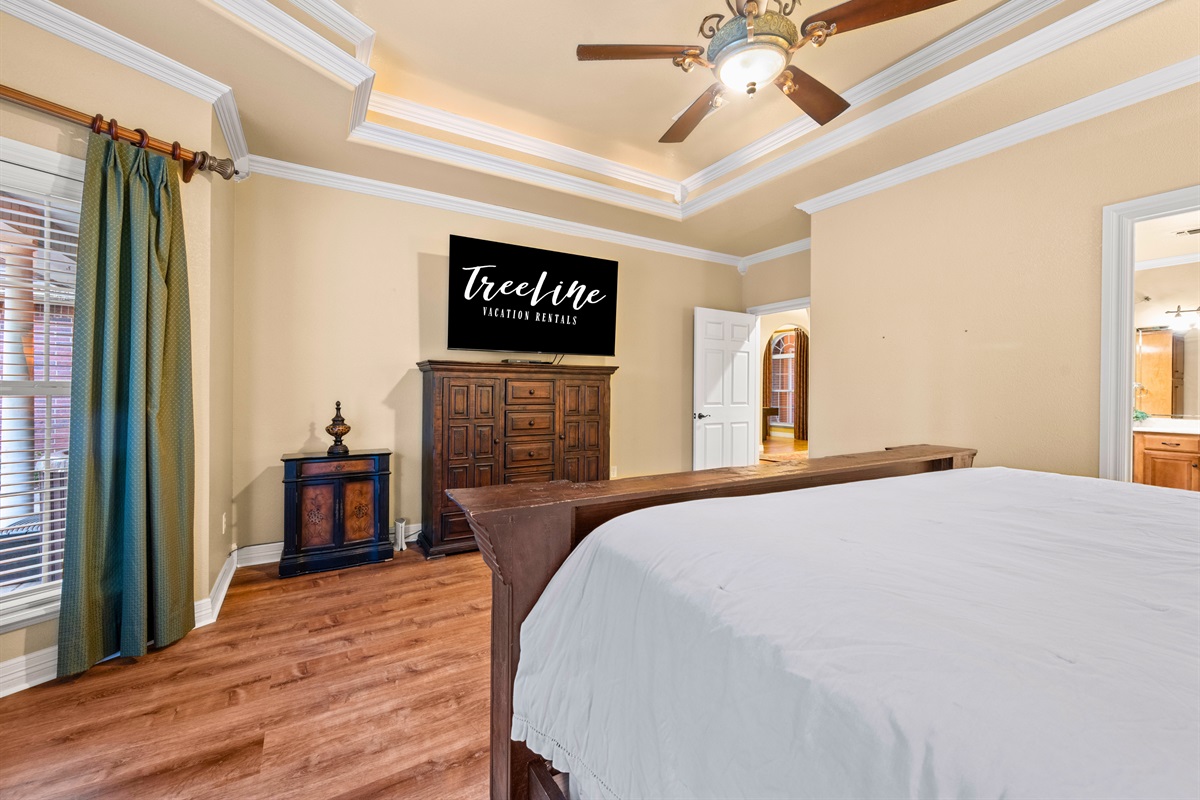 Spacious king suite with sitting area and natural light.