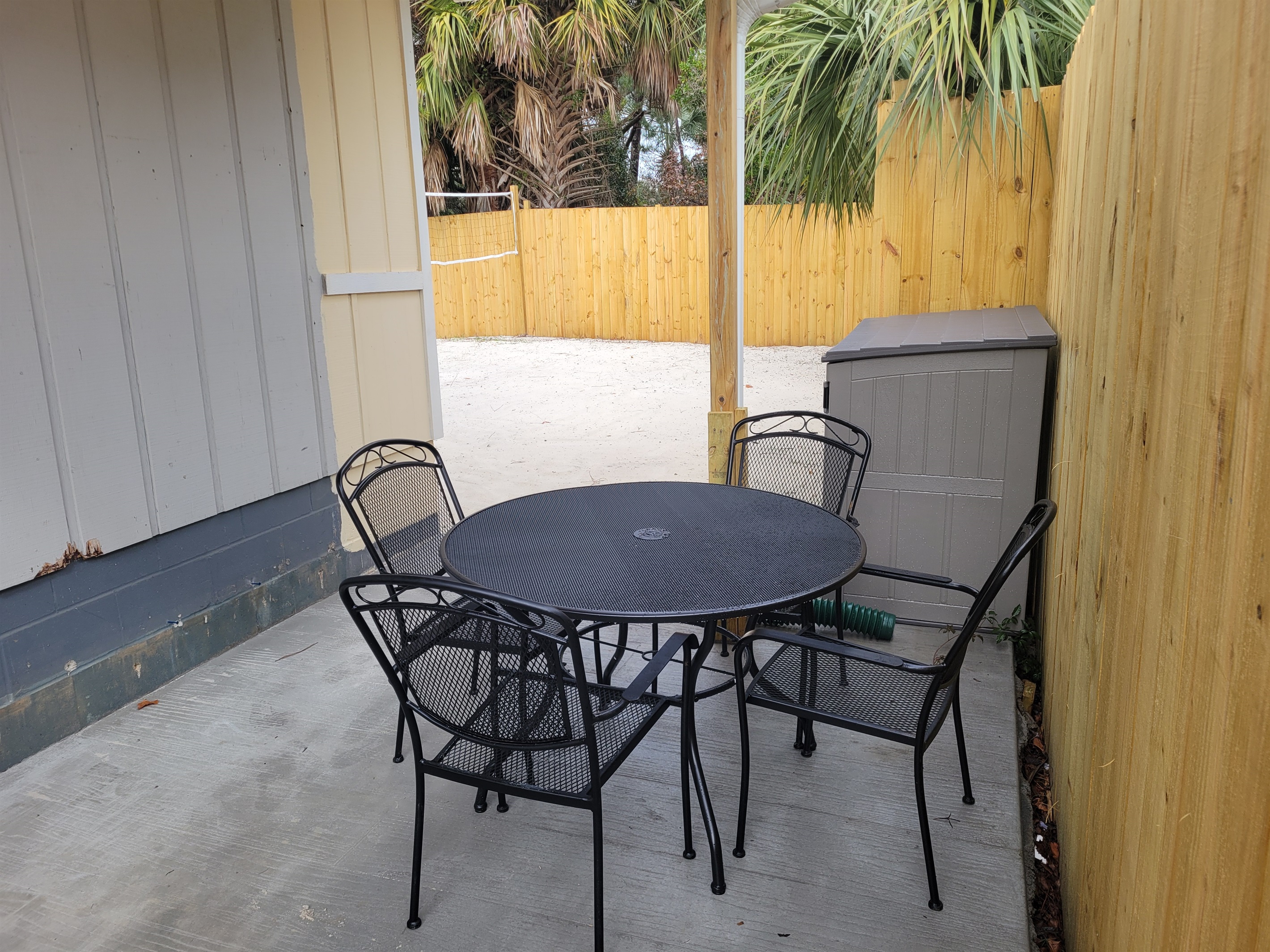 Outdoor seating to watch the kids play in the sand while the adults have a nice card game or some snacks.