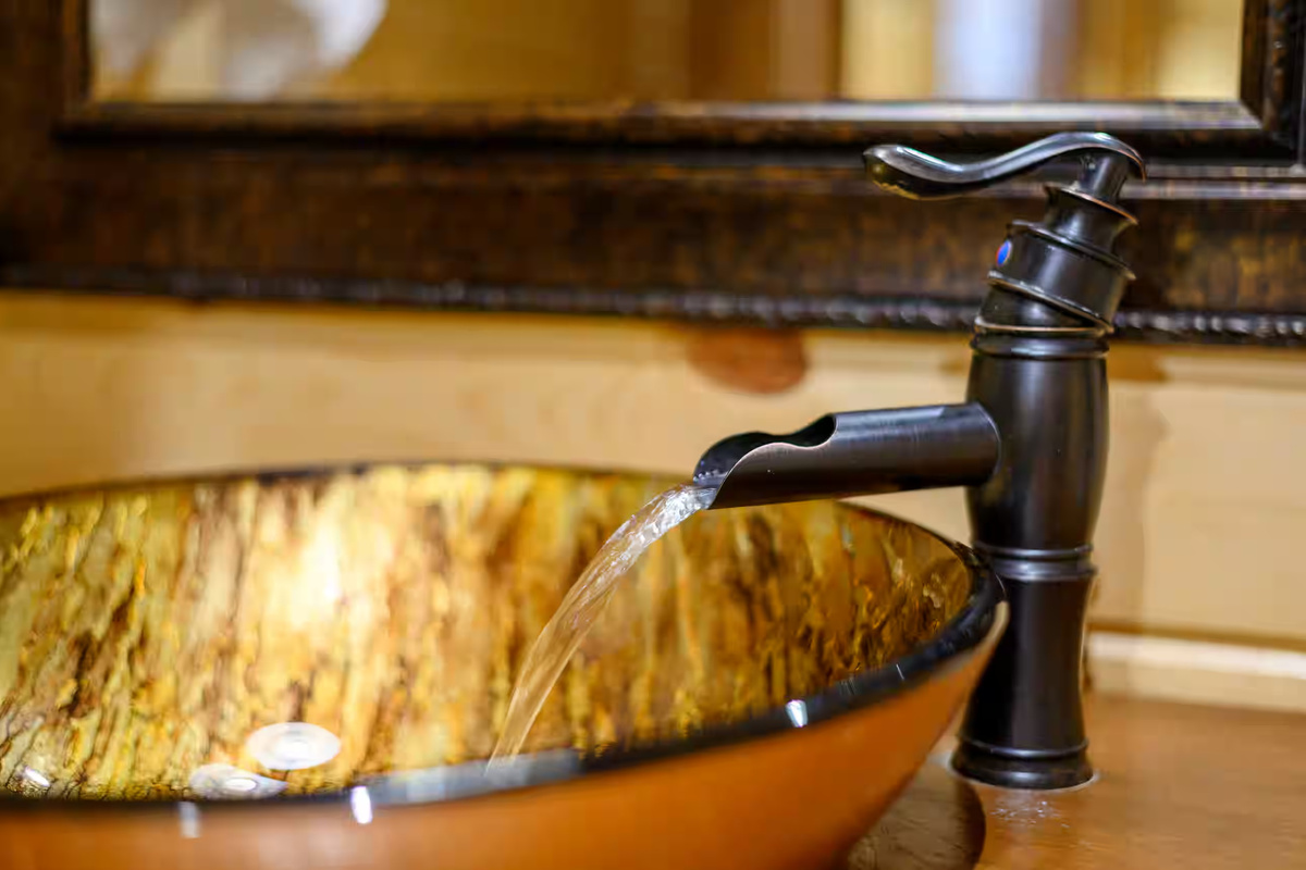 Luxurious Bathroom: Bask in elegance with a stunning basin and unique fixtures for relaxation!