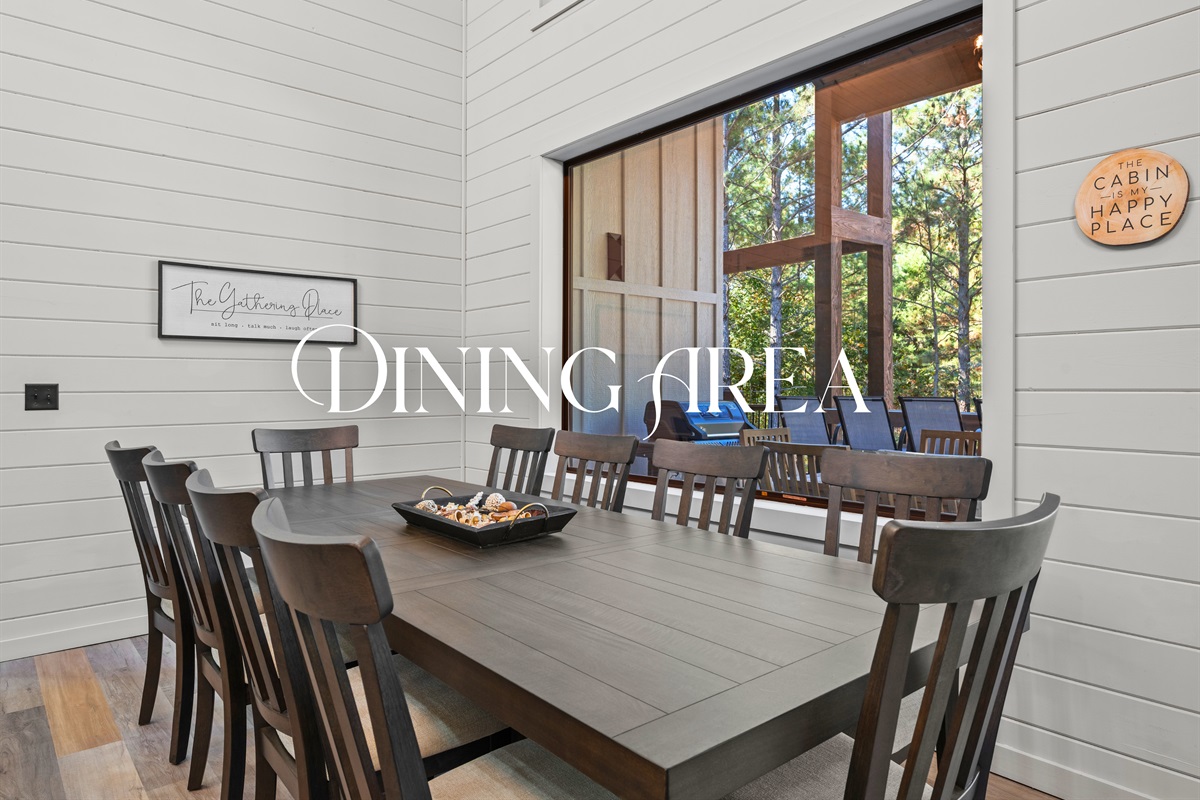 Share hearty meals and great conversation at this large dining table with peaceful views of the surrounding woods.