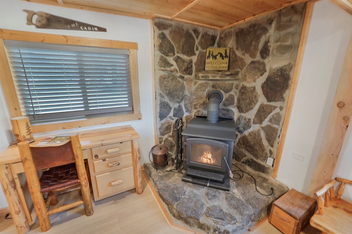 Cozy wood stove and workspace area for relaxing or remote work