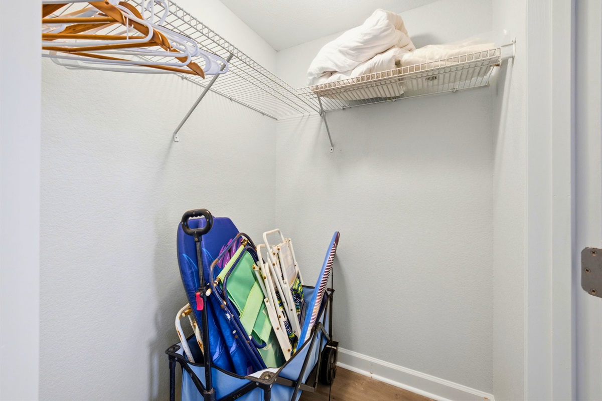 The spacious closet provides convenient storage for beach gear, luggage, and vacation essentials.