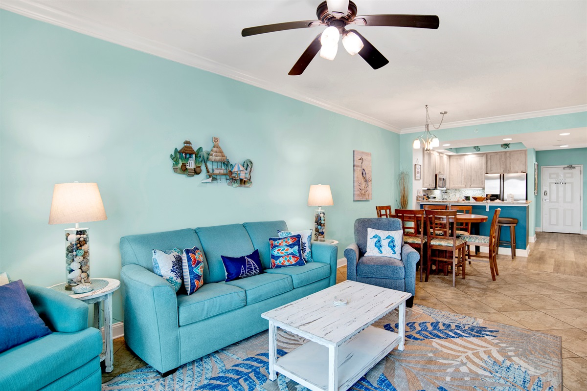 Living room sleeper sofa, 2 end tables, coffee table 2 arm chairs, ceiling fan and a 55" wall mounted Smart TV and a great direct Gulf view