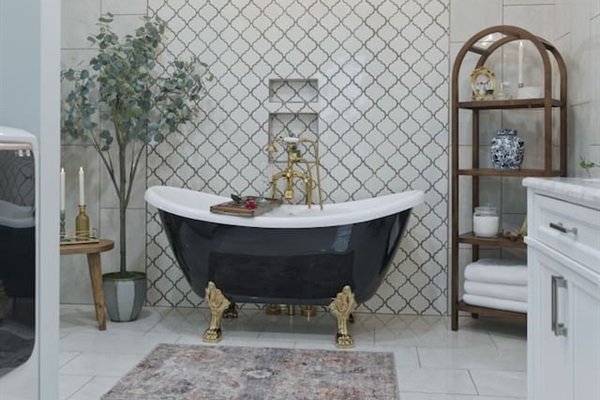 Spacious and beautifully designed bathroom with a statement clawfoot tub and elegant finishes for a relaxing, upscale feel
