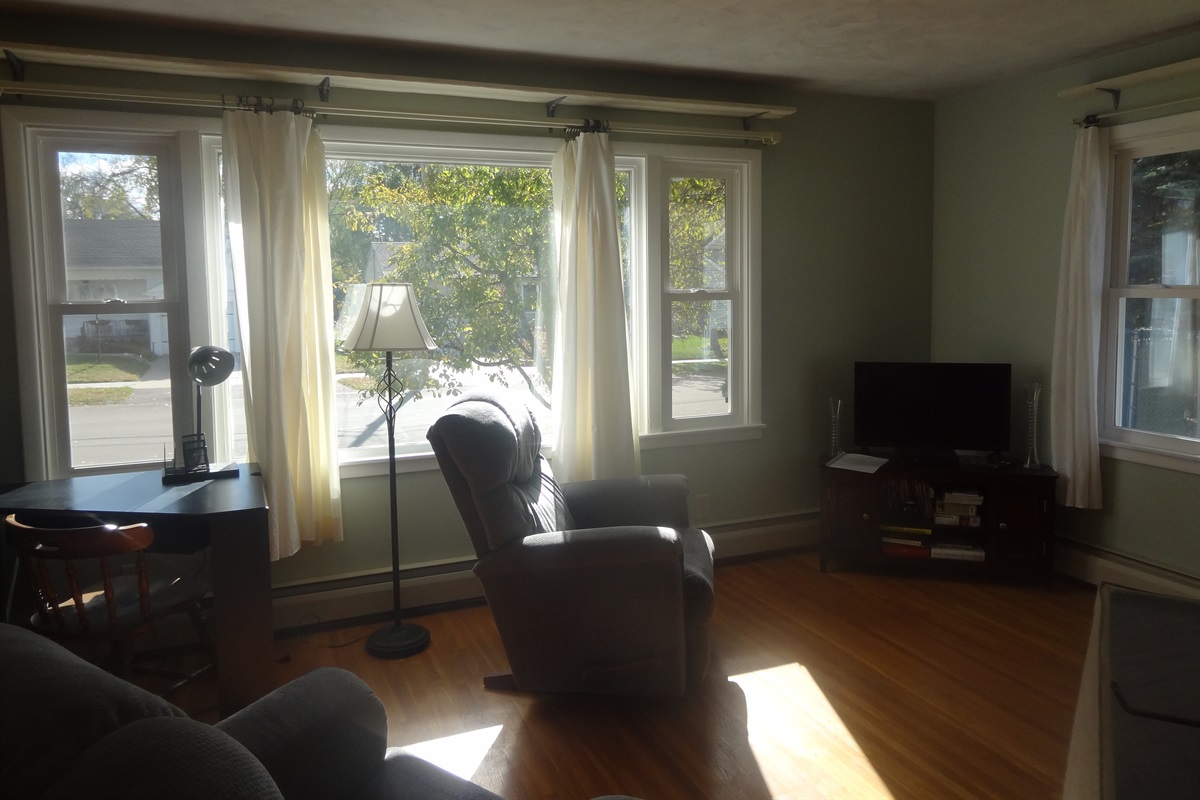 Full size couch, 2 recliners, Roku smart TV, laptop work space