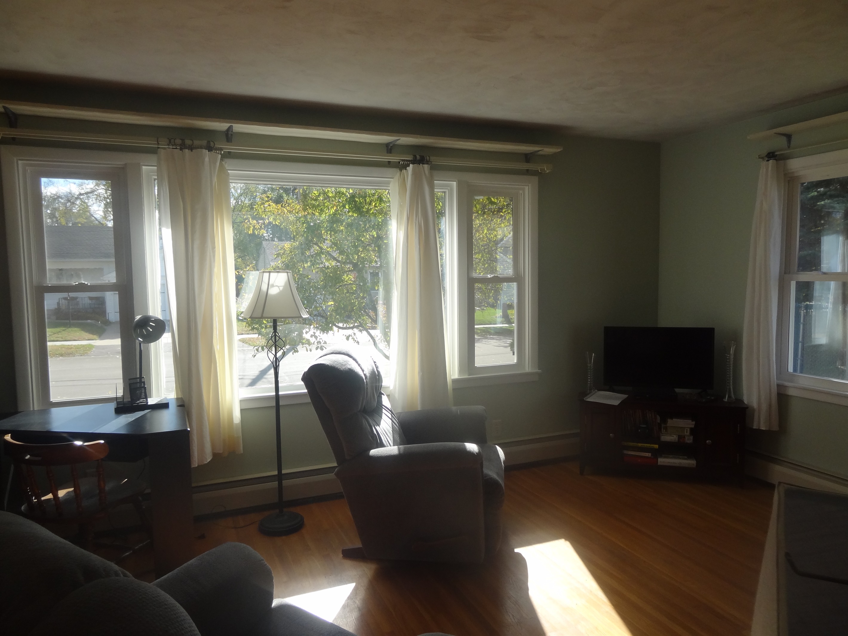 Full size couch, 2 recliners, Roku smart TV, laptop work space