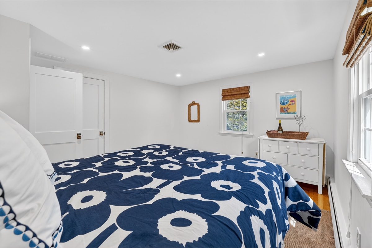 Our inviting first bedroom with a cozy queen bed