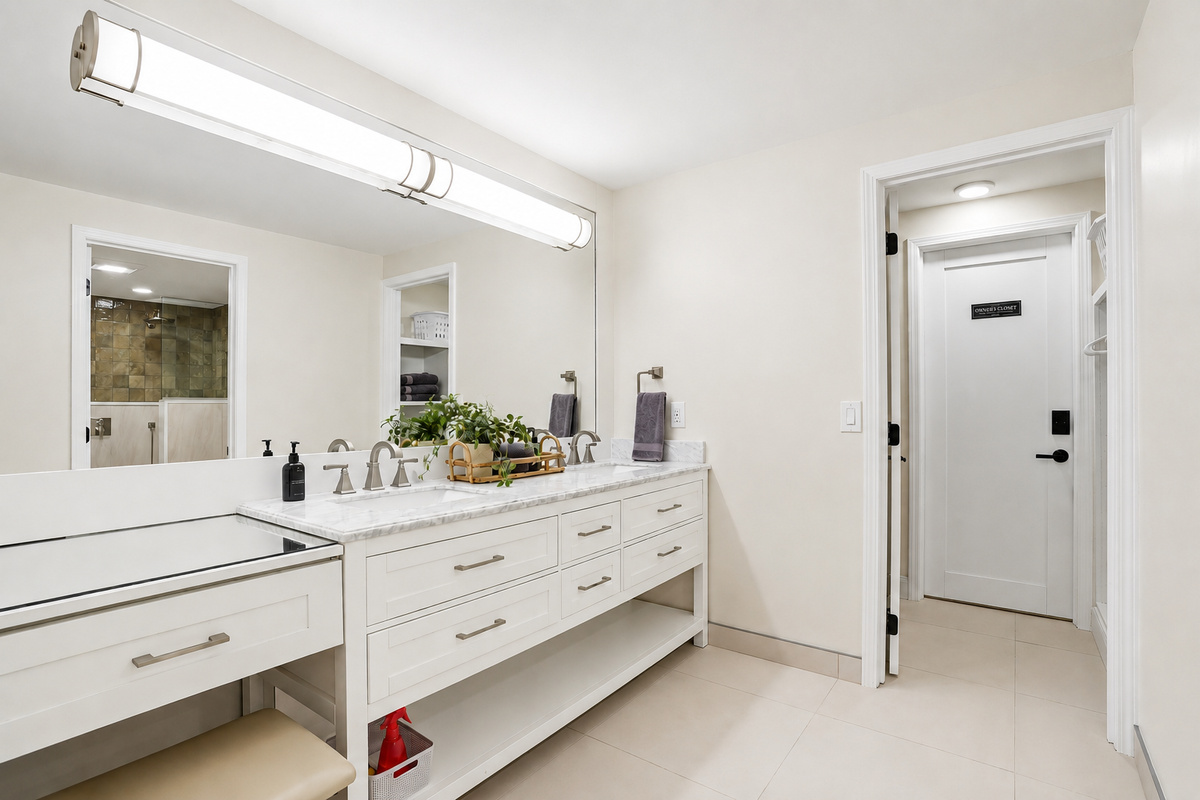 Bright, modern double vanity bathroom with quartz countertops, clean white cabinetry, and ample storage. Fresh, minimalist design with a hotel-like feel, perfect for a comfortable and elevated stay.