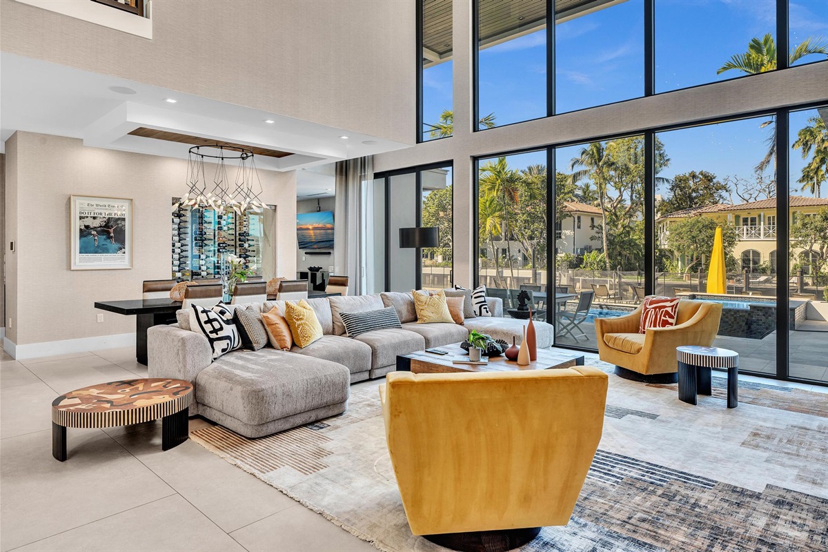 Spacious luxury living room with upscale décor, generous seating, and large Smart TV — ideal for group stays and elevated entertaining.