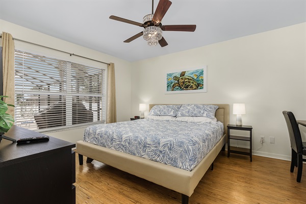 Master bedroom with king bed, bathroom en suite, and work station.