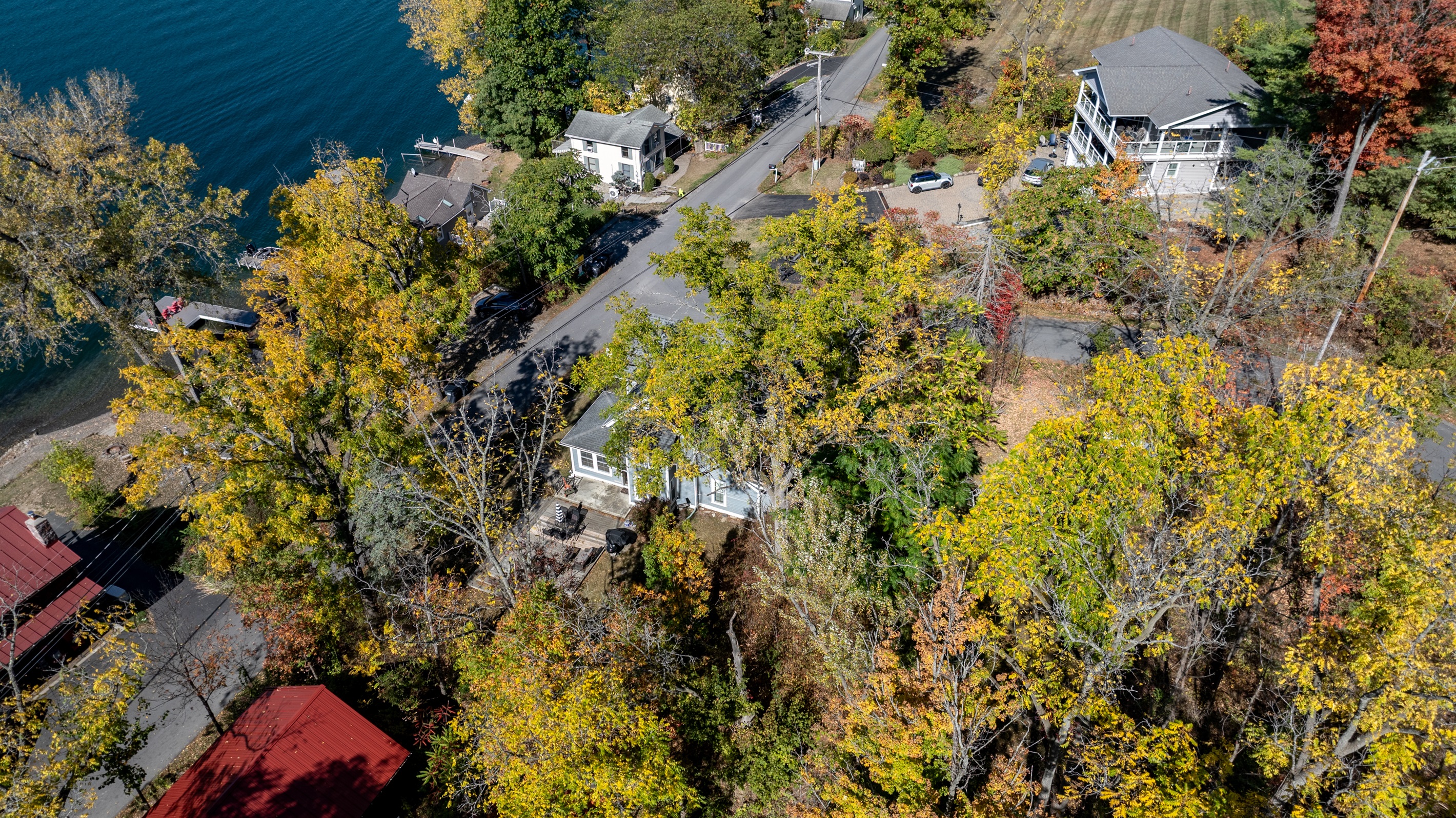 Nestled between trees, this cozy retreat is your upstate hideaway for all seasons