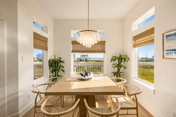 Enjoy delicious meals at the table seating 8 watching the waves crash.