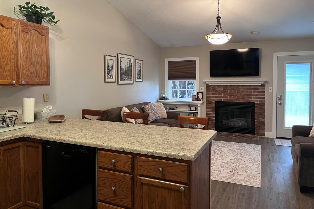 Open kitchen/ living room. Watch the game while you prepare a snack.