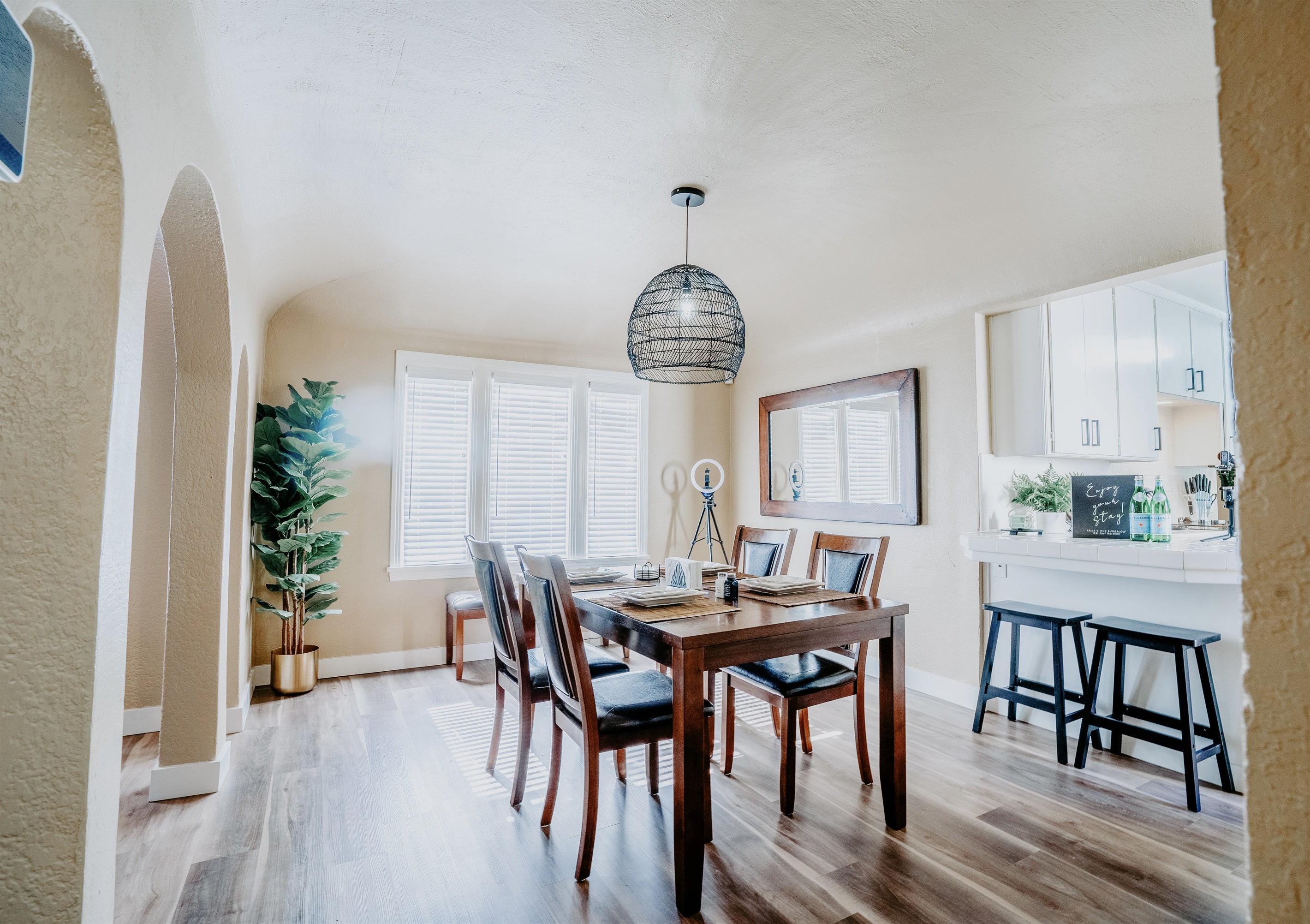 Dining area with table, chairs, counter, and bar stools