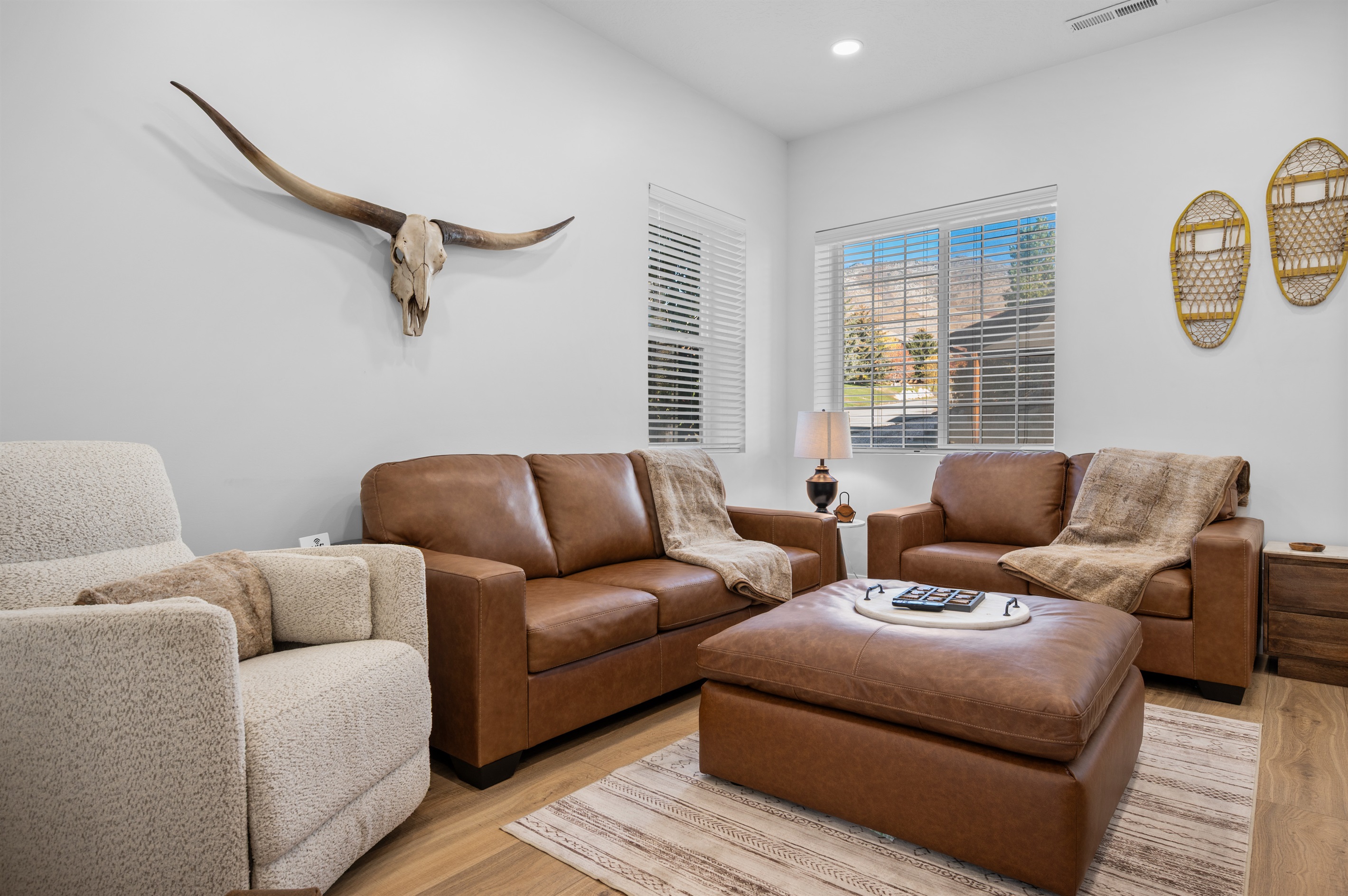 Bright and inviting living room with modern mountain décor and comfortable seating.
