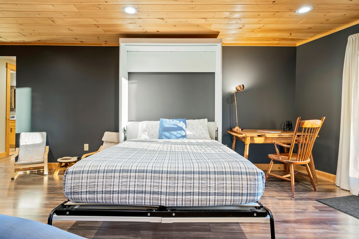 Comfortable queen Murphy bed — perfect for extra guests.