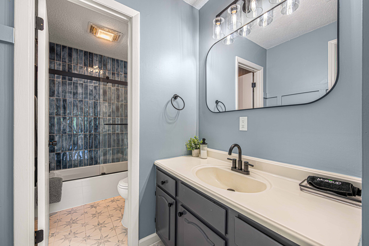 Bathroom Retreat: Sleek design with stunning tile and modern fixtures for your refreshing getaway!