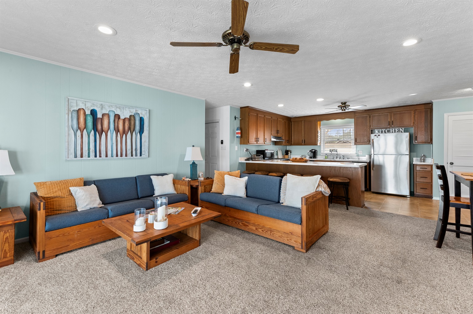 Living Room: Relax in style with a chic design, bright finishes, and views of Topping’s charm!