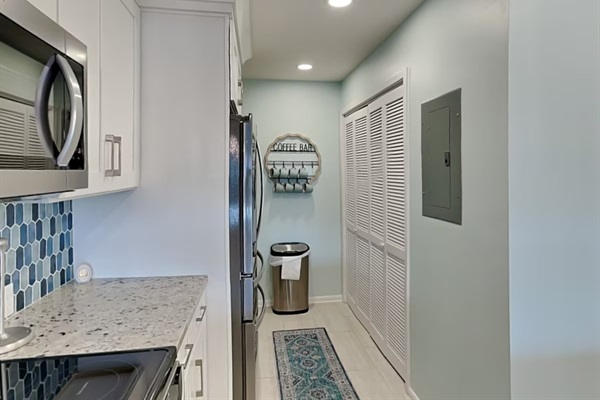 Kitchen area with washer and dryer