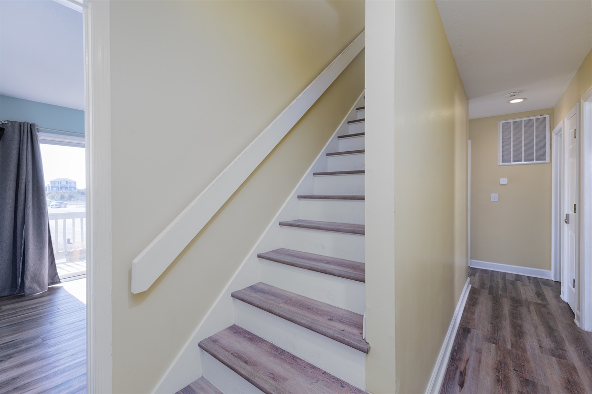 Stairs to the property's 1st floor