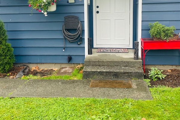 The front door welcomes guests with charm and a hint of the home’s inviting character.