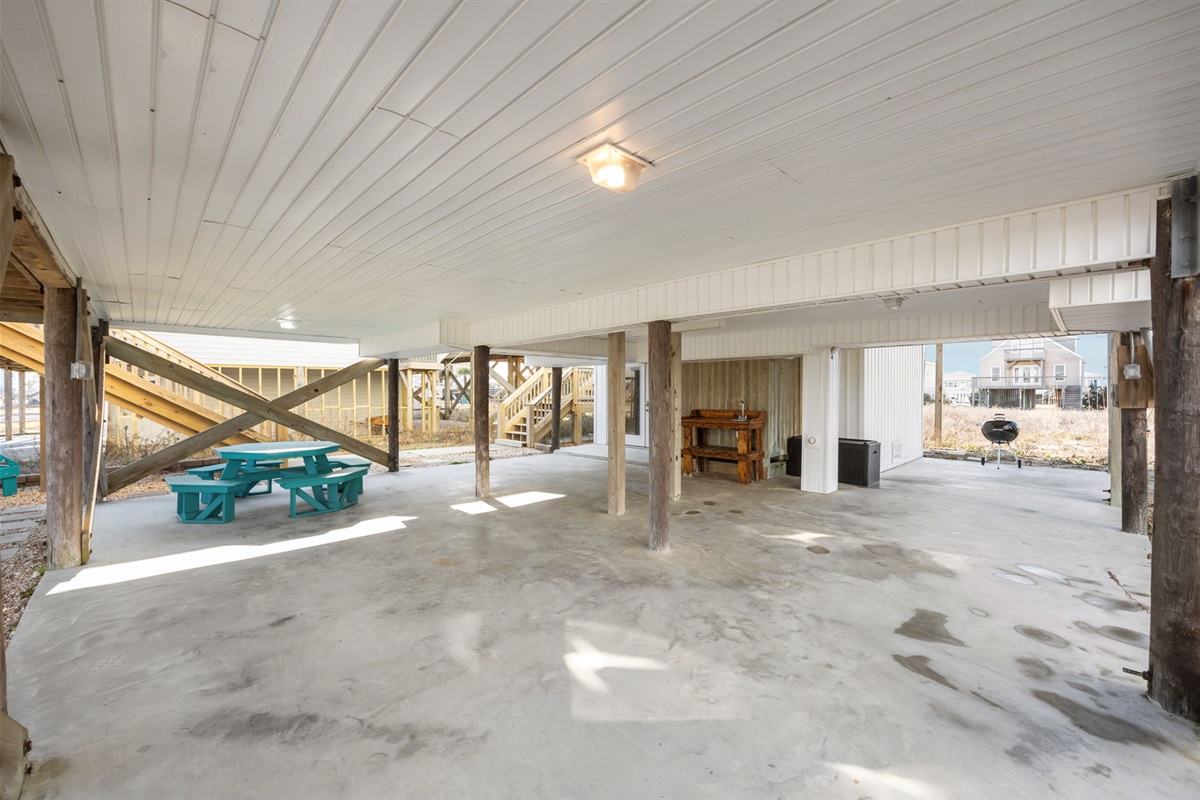 Covered ground-level space with picnic seating and plenty of shade