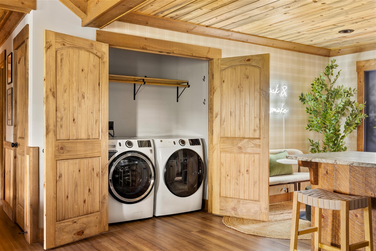 A hidden laundry space, seamlessly tucked into the kitchen, designed for convenience without ever interrupting the beauty of the space.